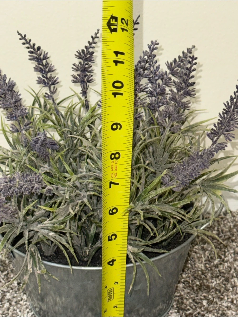 Artificial lavender plant in silver bucket